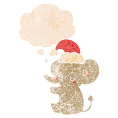 cute christmas elephant and thought bubble in retro textured style