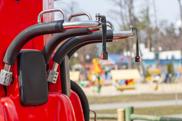 Fototapeta na wymiar close up red chairs at amusement park.terrible fun amusement.