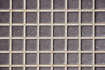 Embossed old metal floor texture, surface  in a cage . Rusty metal floor, industrial flooring. Close-up. Selective focus. Copy space.