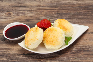 Curd pancakes with jam and stravberry