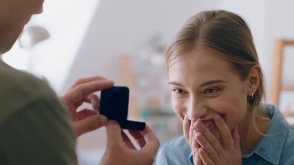 happy couple marriage proposal young man in love proposing to girlfriend enjoying romantic surprise engagement ring hugging boyfriend smiling excited 4k - Powered by Adobe