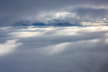 Fototapeta na wymiar Clouds shortly before landing at svalbard, Artic, Norway