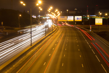 Night road with car light trails