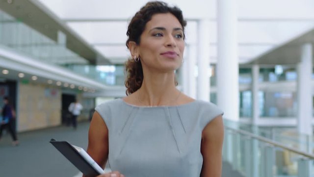confident business woman walking in airport smiling independent female executive enjoying successful corporate career 4k footage