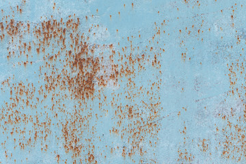 Rusty metal texture with scratches and cracks. paint traces. Blue and dirty orange colors. Copy space