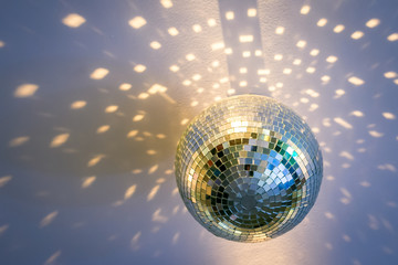 a mirror disco ball on the ceiling that sparkles around beautiful glare