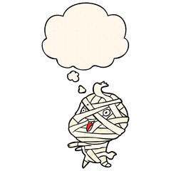 cartoon halloween mummy and thought bubble in comic book style