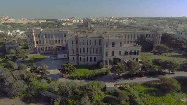 Aerial shot of school. Aerial shoot of frontage of school with nice surroundings and trees and green grass field near town