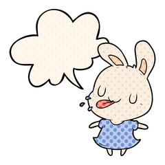 cute cartoon rabbit blowing raspberry and speech bubble in comic book style