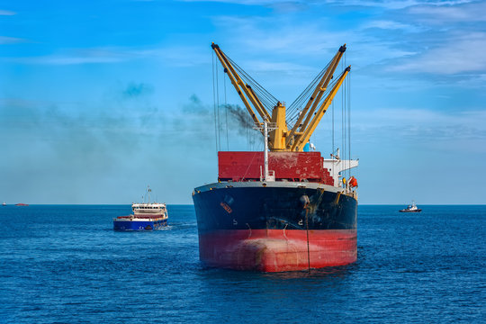 Bulk carrier vessel is awaiting loading of bauxite ore at outer anchorage of Kamsar port, Guinea, West Africa.
