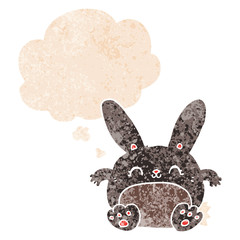 cartoon rabbit and thought bubble in retro textured style