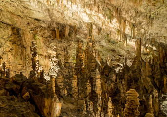 Stalactites and stalagmites underground in cave system in Postojna