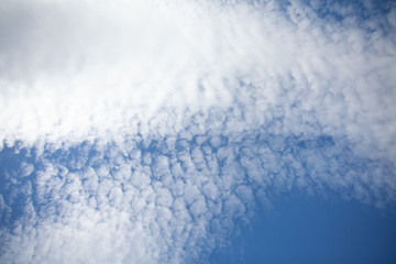 Beautiful view of hight blue sky with clouds. Happiness and freedom. Concept of climate, weather, environment. Background for design. Copy space.