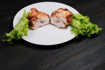 Home chop cut in half made in France. Cutlet de volaille with stuffing, breaded with lettuce. French chicken breast cutlet.