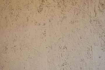 Abstract background. Oriental chipboard is painted with white paint. Visible glued wood chips.