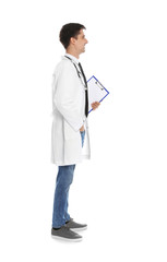 Full length portrait of medical doctor with clipboard and stethoscope isolated on white