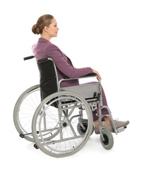 Beautiful young businesswoman in wheelchair isolated on white