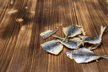 Salted fish lying on a wooden table