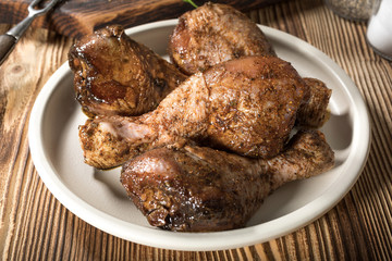 Raw marinated chicken drumsticks.