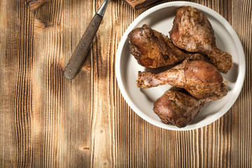 Raw marinated chicken drumsticks.