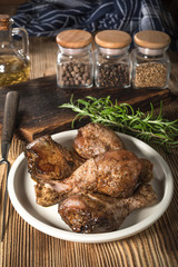 Raw marinated chicken drumsticks.