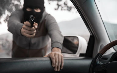 Fototapeta na wymiar man with a gun threatened driver