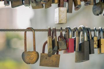 locked heart lock with a heart and a lot of other locks on the bridge