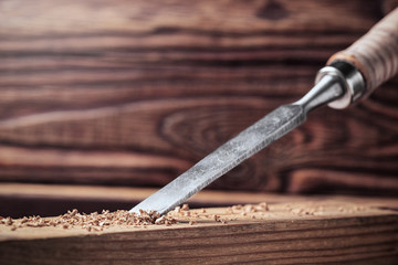 chisel cut groove in wooden pine plank. joinery, wood carving , carpenter's skill.