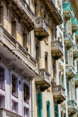 Obraz premium Exterior view of the residential buildings in the Old Havana City, Capital of Cuba, during a sunny day.