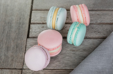 Close up colorful macarons dessert with vintage pastel tones