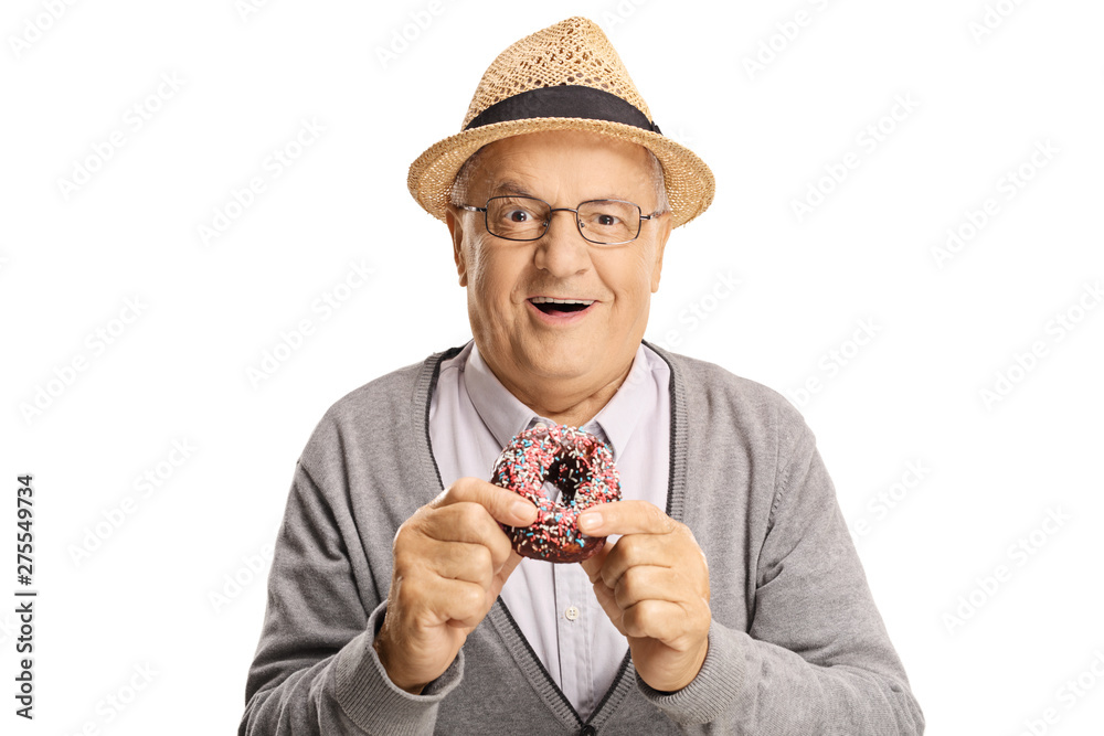 Canvas Prints cheerful senior man eating a donut