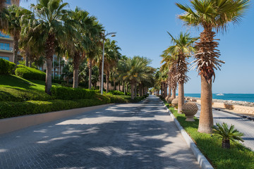 Fototapeta na wymiar DUBAI, UAE - The Boardwalk on the Palm Jumeirah Island on the Crescent. The Palm Jumeirah is an artificial archipelago created using reclaimed land