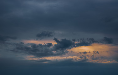Fototapeta na wymiar Dark storm cloud sky background. Thunder Sky. The sun among the clouds.