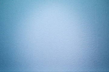 Light cloud of light on a uniform textural background