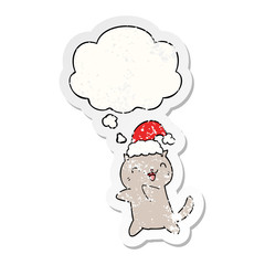 cute cartoon christmas cat and thought bubble as a distressed worn sticker