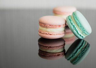 Close up colorful macarons dessert with vintage pastel tones