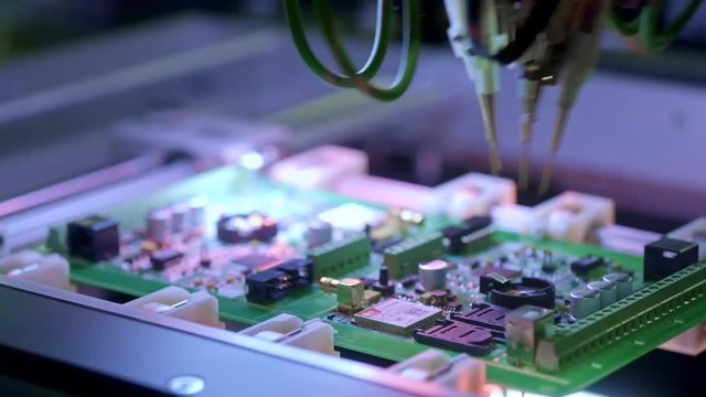 Electronic circuit board production. Automated Circut Board machine Produces Printed digital electronic board. Electronics contract manufacturing. Manufacture of electronic chips. High-tech.