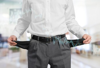 Businessman showing his empty pockets, isolated