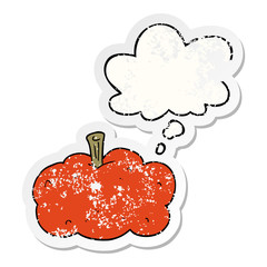 cartoon pumpkin and thought bubble as a distressed worn sticker