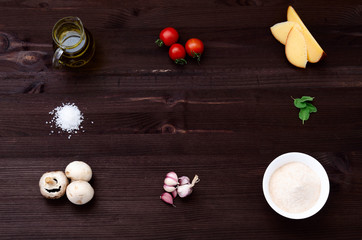ingredients for pizza on wooden background