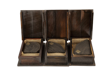 Souvenirs from sea oak in a wooden box on a white background, isolate.