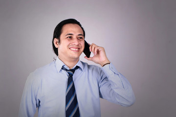 Young Man Talking on his Phone, Happy Smiling Laughing