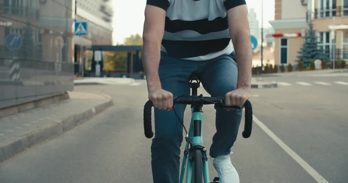 Cyclist man riding fixed gear sport bike