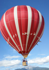  hot air balloon Red traveling in blue sky 