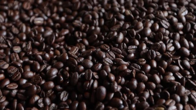 Slow motion coffee beans close