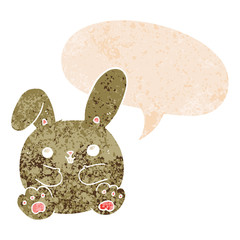 cartoon rabbit and speech bubble in retro textured style