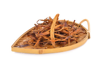 dried day lily flowers on bamboo plate on white background