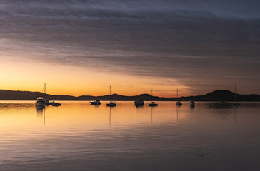 High Clouds, Boats, Reflections and Sunrise on the Bay