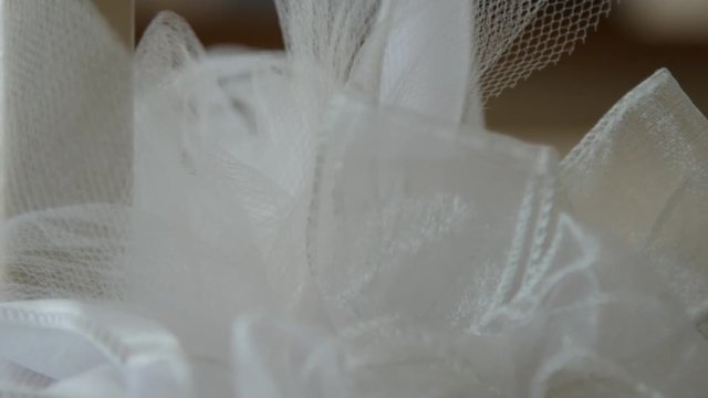 Close up of wedding white bow on staircase