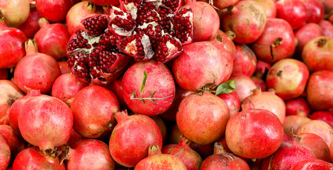 Pomegranates in a pile at the market. 